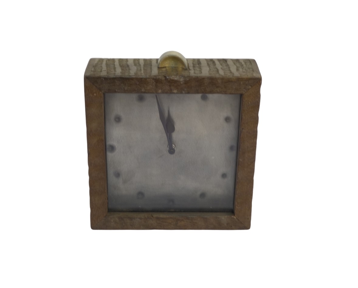 Wooden striped clock with riveted dial